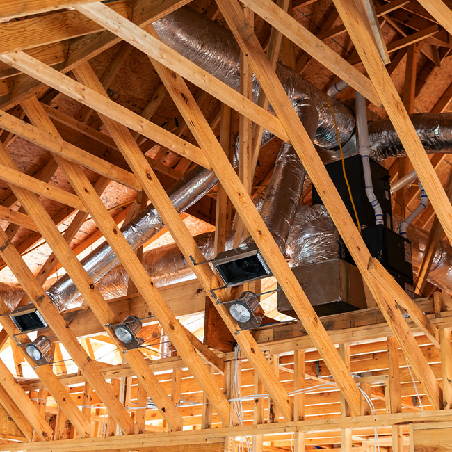 a houses wood frame during construction with ductwork installed naples fl